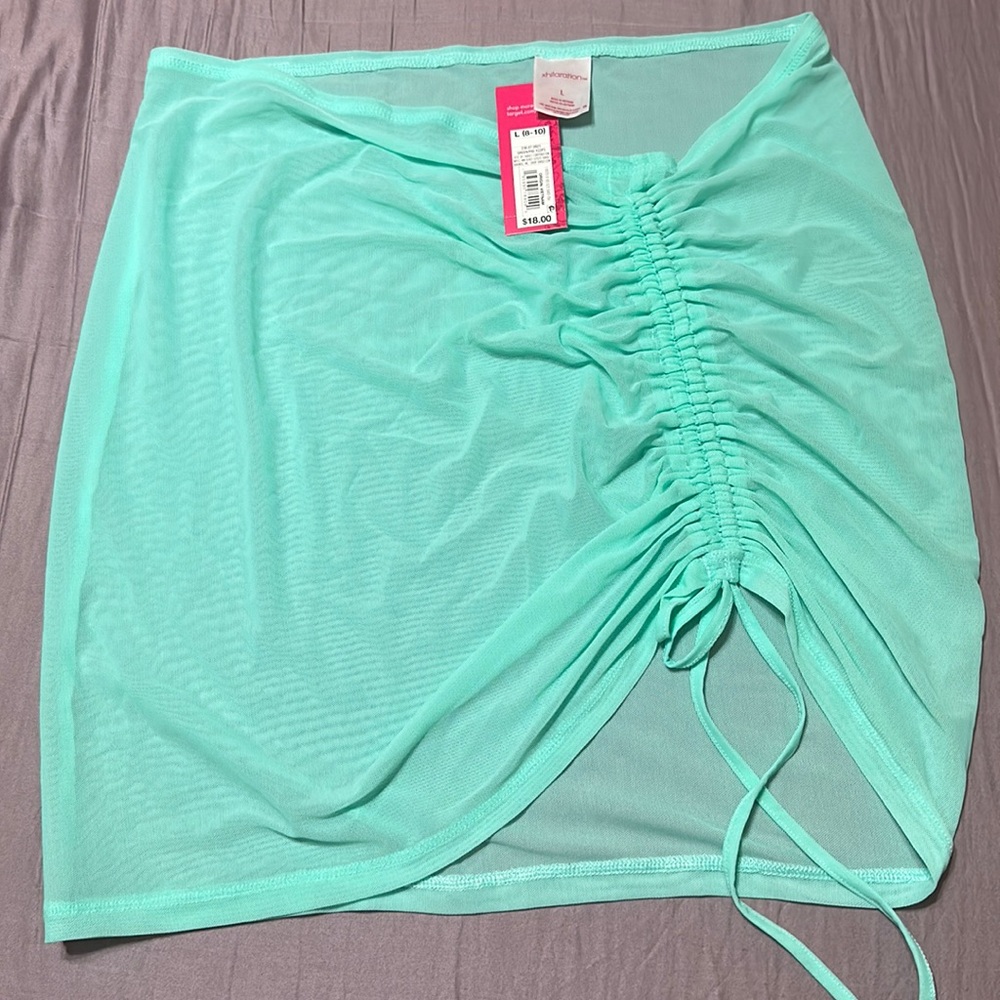 Brand new with tag sheer swim cover.